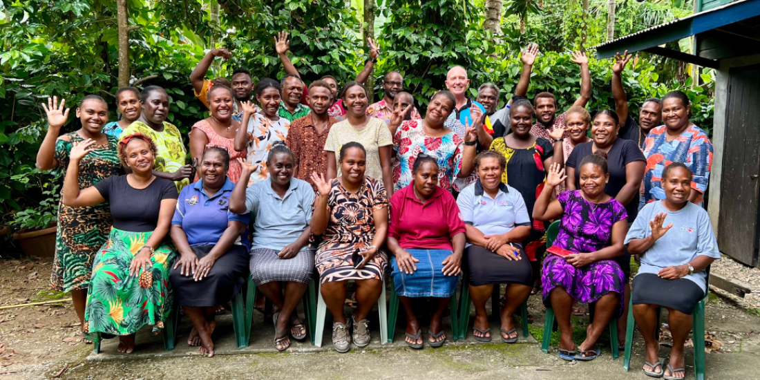A group of Solomon Islander nurses smiling at the camera