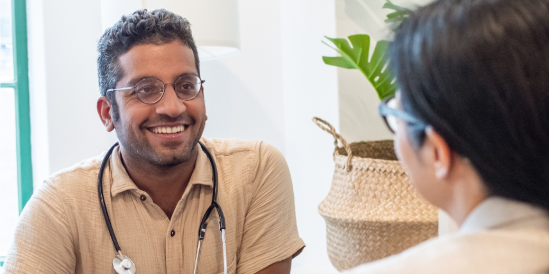 Male doctor talking to patient