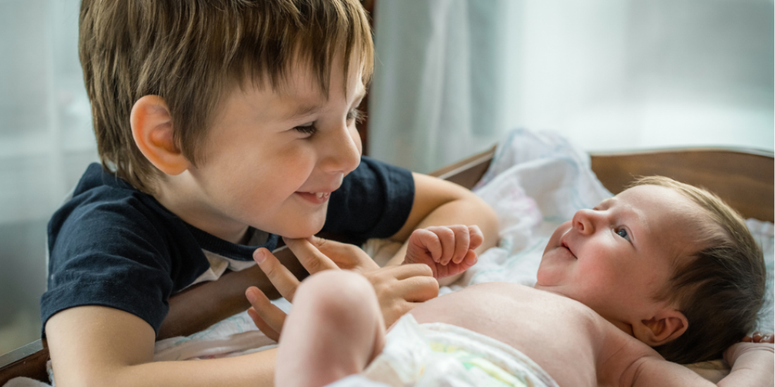 New born baby and sibling