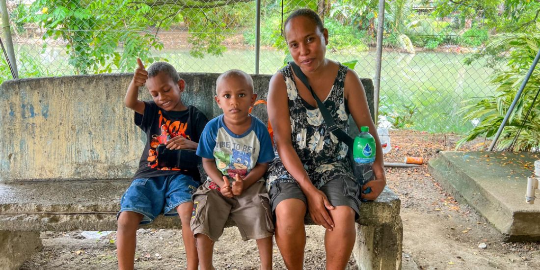 A mother with her children in Honiara, Solomon Islands