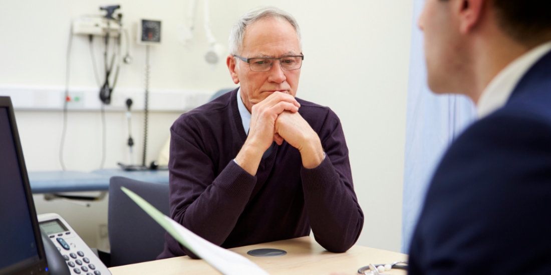 A concerned older male patient consulting with his GP